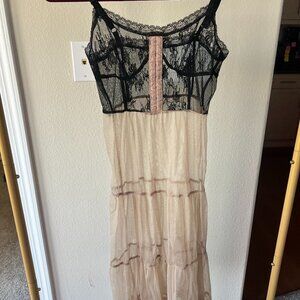 Size small sheer slip dress. With black and tan lace.